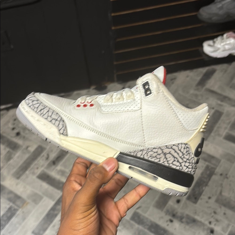 White and Gray Sneakers with Red Accents